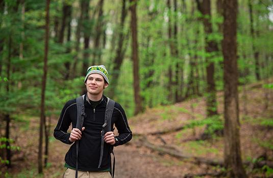 Joshua walking in the woods